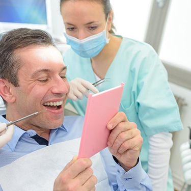 Patient looking at their dental work