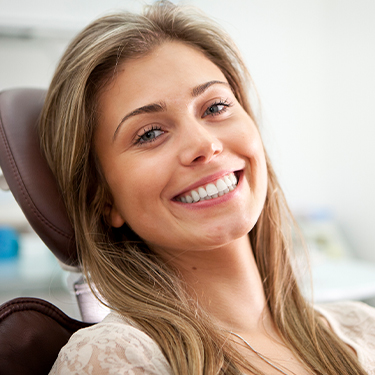 Smiling woman in dental chair for dental checkup