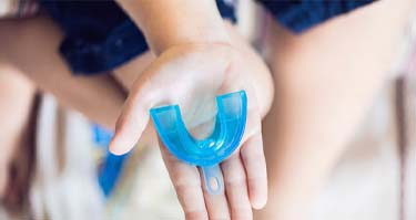 Closeup of sports mouthguard for preventing cracked tooth in Guilderland
