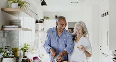 senior couple cooking in their kitchen 