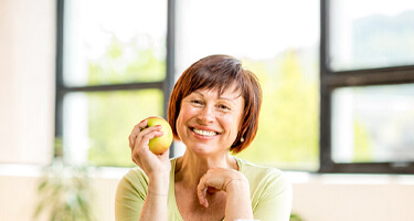 Woman eating an apple in Guilderland