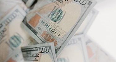 Folded money on table