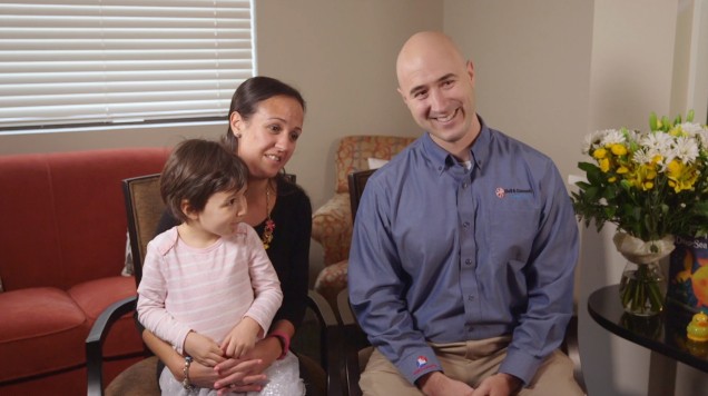 Mother father and toddler sitting in dental office