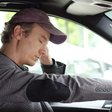 Man falling asleep while driving