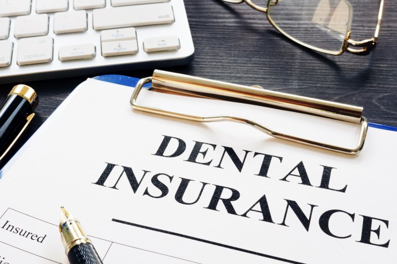 Dental insurance paperwork on desk