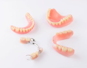 Full and partial dentures on a white background